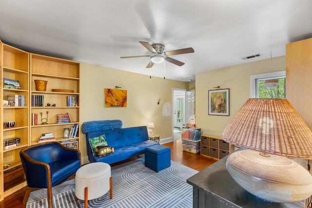 sitting room featuring ceiling fan and hardwood / wood-style flooring