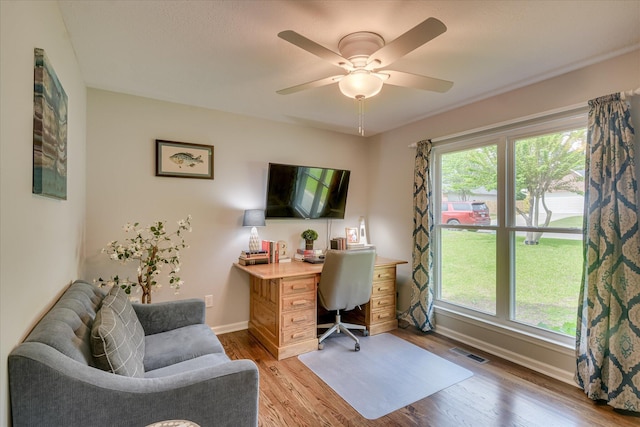 office with visible vents, ceiling fan, light wood-style floors, and baseboards
