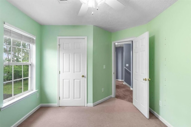 2409 Par Dr, Augusta, GA 30906 - unfurnished bedroom with baseboards, multiple windows, and light carpet