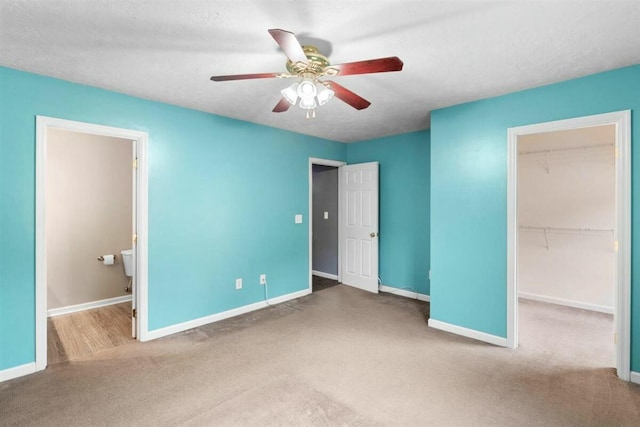 2409 Par Dr, Augusta, GA 30906 - unfurnished bedroom featuring baseboards, carpet flooring, a walk in closet, and a closet