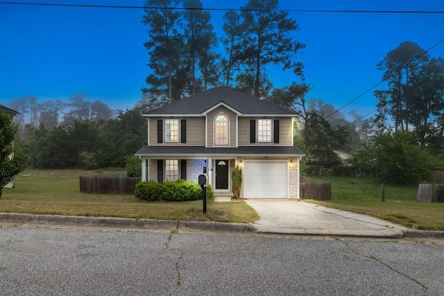 2409 Par Dr, Augusta, GA 30906 - traditional-style house with fence, an attached garage, concrete driveway, and a front lawn
