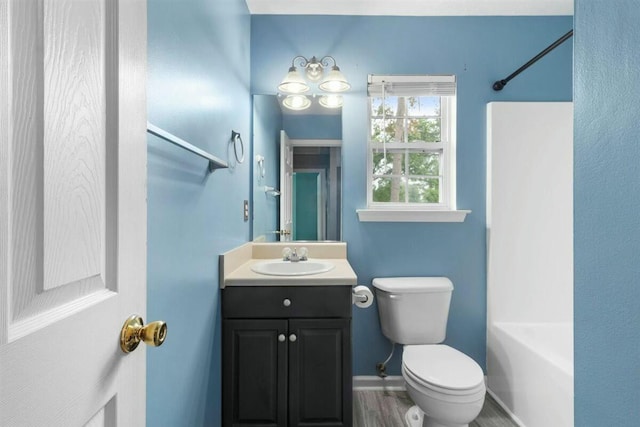 2409 Par Dr, Augusta, GA 30906 - bathroom featuring toilet, baseboards, wood finished floors, and vanity