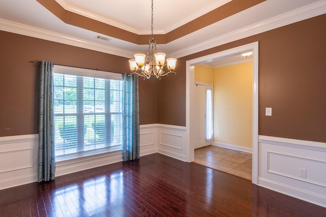 219 Devonshire Dr, Thomson, GA 30824 - spare room featuring a chandelier, hardwood / wood-style flooring, a wainscoted wall, a decorative wall, and ornamental molding