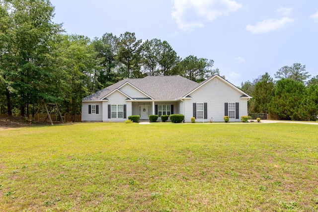 219 Devonshire Dr, Thomson, GA 30824 - ranch-style house with a front lawn and a shingled roof