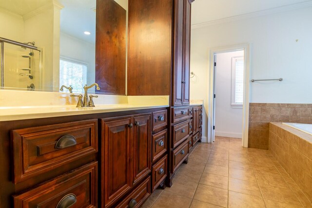 219 Devonshire Dr, Thomson, GA 30824 - full bathroom featuring ornamental molding, double vanity, a bath, tile patterned floors, and baseboards