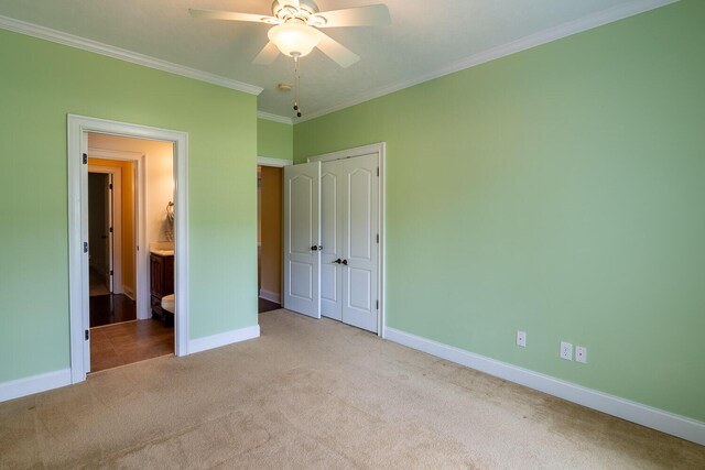 219 Devonshire Dr, Thomson, GA 30824 - unfurnished bedroom featuring carpet, baseboards, a closet, crown molding, and ensuite bath