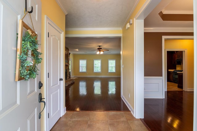 219 Devonshire Dr, Thomson, GA 30824 - foyer with hardwood / wood-style flooring, ceiling fan, crown molding, and wainscoting