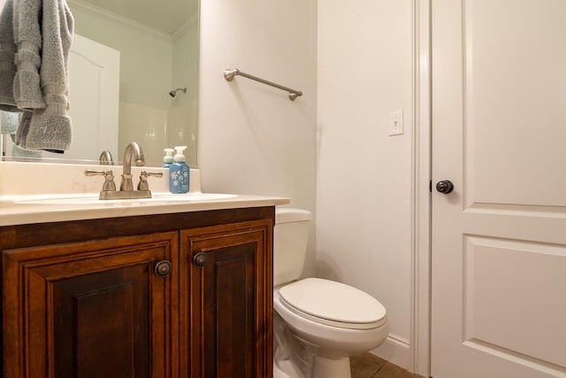 219 Devonshire Dr, Thomson, GA 30824 - bathroom featuring vanity, ornamental molding, toilet, and tile patterned flooring