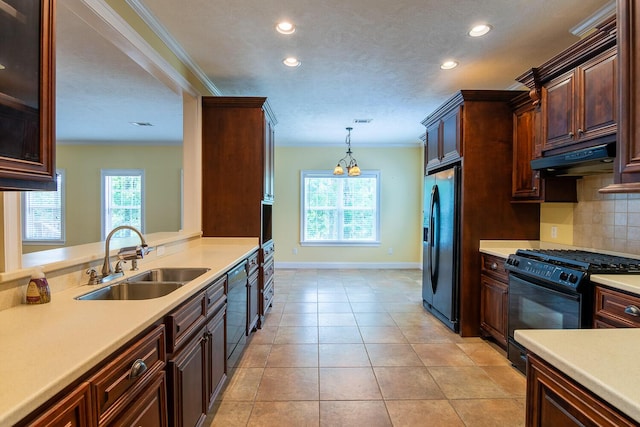 219 Devonshire Dr, Thomson, GA 30824 - kitchen featuring a sink, black appliances, recessed lighting, light countertops, and decorative backsplash