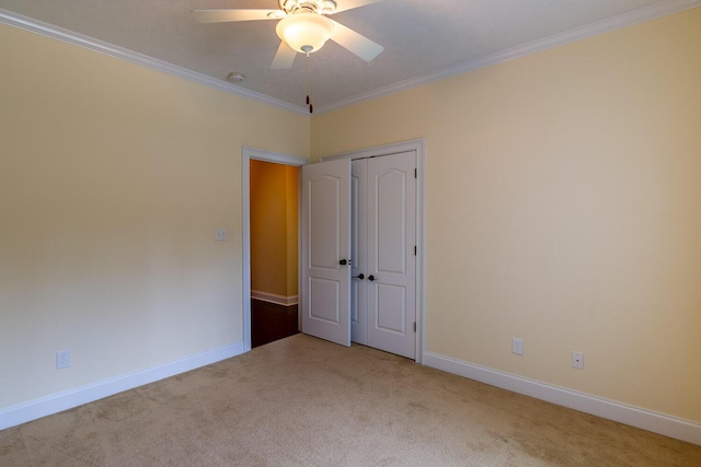 219 Devonshire Dr, Thomson, GA 30824 - unfurnished bedroom featuring carpet, crown molding, baseboards, a closet, and ceiling fan