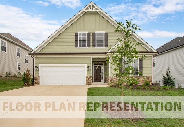 craftsman inspired home featuring a garage and a front lawn