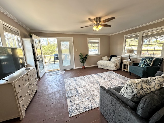 living area featuring brick floor, a ceiling fan, and crown molding