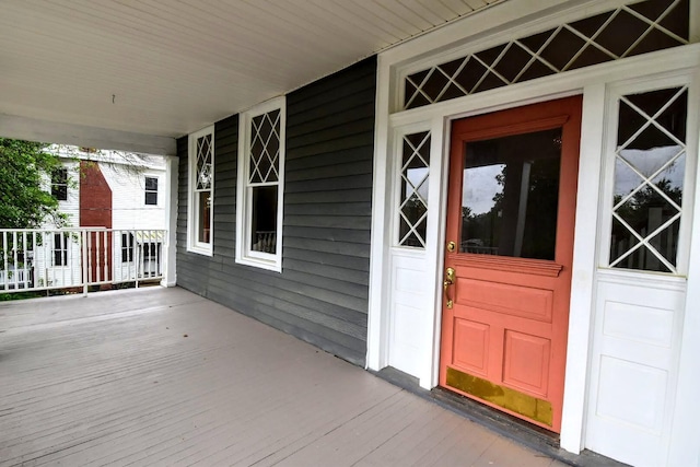 doorway to property featuring covered porch