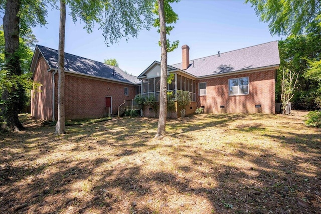 4482 Persimmon St, Evans, GA 30809 - back of house with a sunroom, brick siding, crawl space, and a chimney