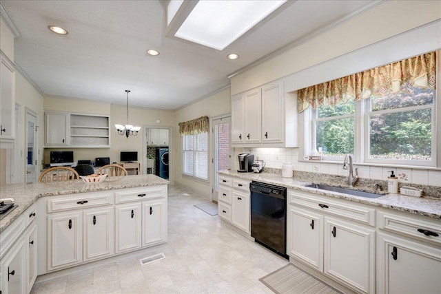 4482 Persimmon St, Evans, GA 30809 - kitchen with black dishwasher, a sink, plenty of natural light, tasteful backsplash, and ornamental molding