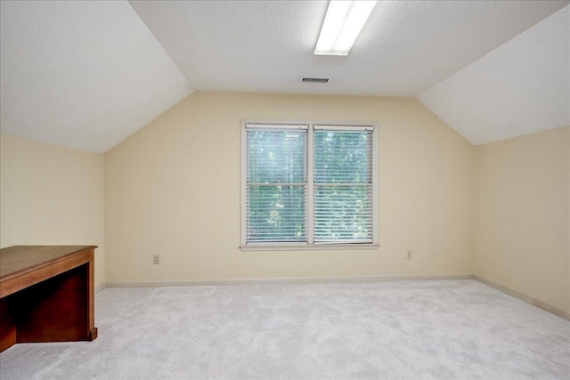 4482 Persimmon St, Evans, GA 30809 - bonus room featuring lofted ceiling, carpet floors, baseboards, and a textured ceiling