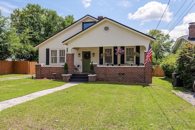1512 Johns Rd, Augusta, GA 30904 - bungalow with stucco siding, a porch, and brick siding