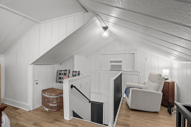 1512 Johns Rd, Augusta, GA 30904 - additional living space with vaulted ceiling, light wood-type flooring, an AC wall unit, and wood walls