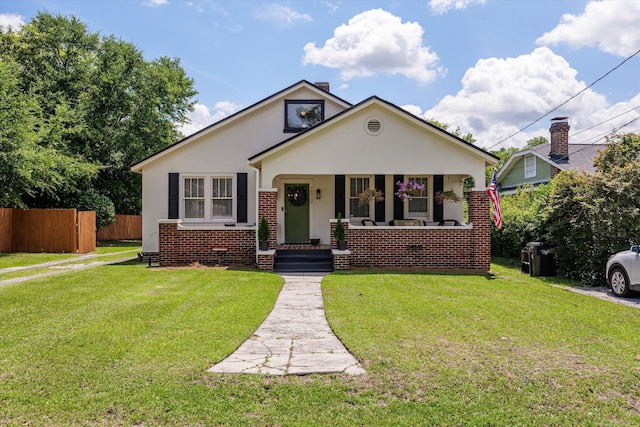 1512 Johns Rd, Augusta, GA 30904 - bungalow-style house featuring stucco siding, covered porch, and brick siding