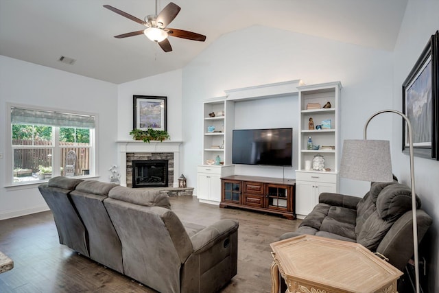 708 Shea Ct, Evans, GA 30809 - living room with ceiling fan, dark wood-style flooring, a stone fireplace, and high vaulted ceiling