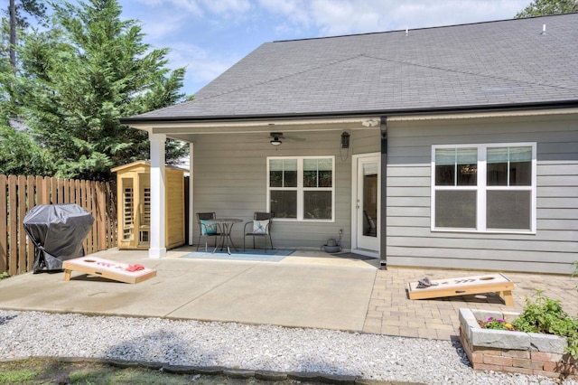 708 Shea Ct, Evans, GA 30809 - back of property with a patio, fence, a storage unit, an outdoor structure, and ceiling fan