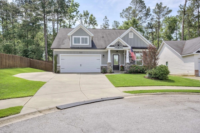 708 Shea Ct, Evans, GA 30809 - craftsman-style home featuring concrete driveway, stone siding, an attached garage, and board and batten siding