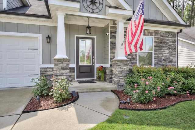 708 Shea Ct, Evans, GA 30809 - doorway to property with board and batten siding, stone siding, and covered porch