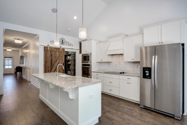 708 Shea Ct, Evans, GA 30809 - kitchen featuring stainless steel appliances, premium range hood, a sink, white cabinets, and high vaulted ceiling