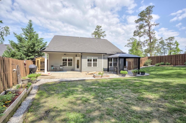 708 Shea Ct, Evans, GA 30809 - back of house featuring a patio, a gazebo, and a vegetable garden