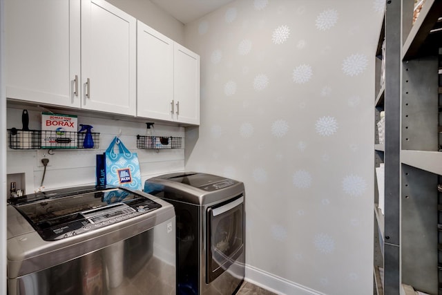 708 Shea Ct, Evans, GA 30809 - laundry room with cabinet space, washer and dryer, wallpapered walls, and baseboards