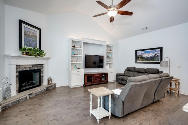 708 Shea Ct, Evans, GA 30809 - living room featuring lofted ceiling, a ceiling fan, wood finished floors, a stone fireplace, and baseboards