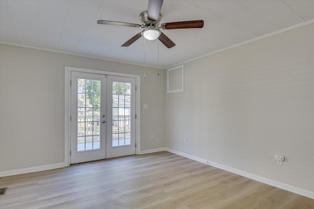 unfurnished room featuring light wood-style flooring, crown molding, and french doors