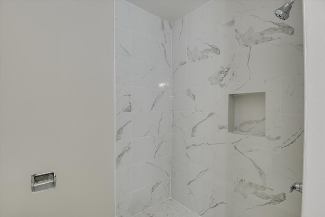 room details with a tile shower