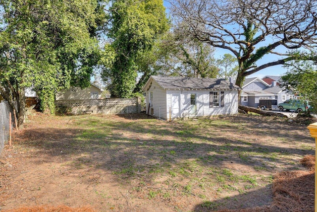 view of yard with an outbuilding and a fenced backyard