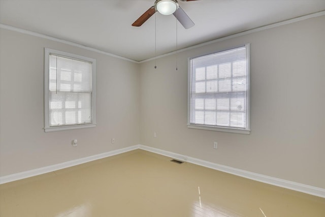 unfurnished room with baseboards, visible vents, ceiling fan, and crown molding