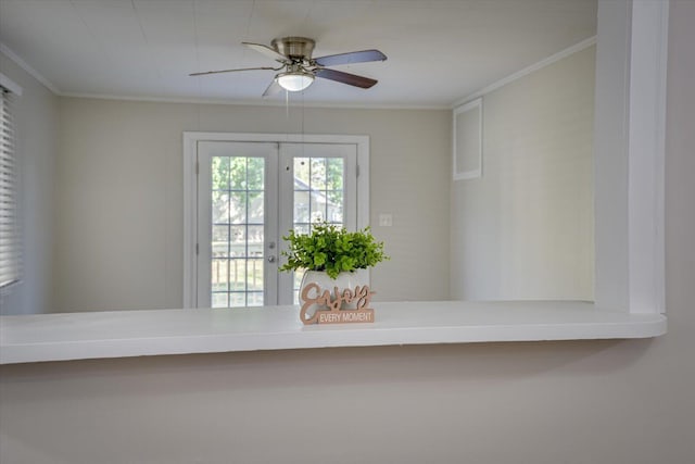 interior details featuring ceiling fan, ornamental molding, and french doors