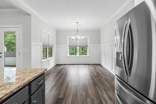 kitchen with stainless steel refrigerator with ice dispenser, a chandelier, a wealth of natural light, and dark wood-style flooring