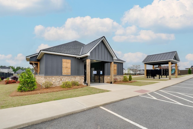 view of building exterior with uncovered parking