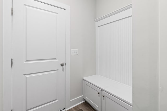 mudroom featuring dark wood-style floors and baseboards