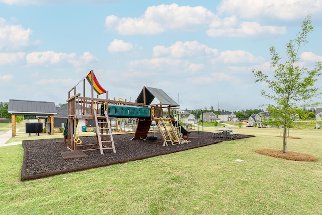 communal playground featuring a yard