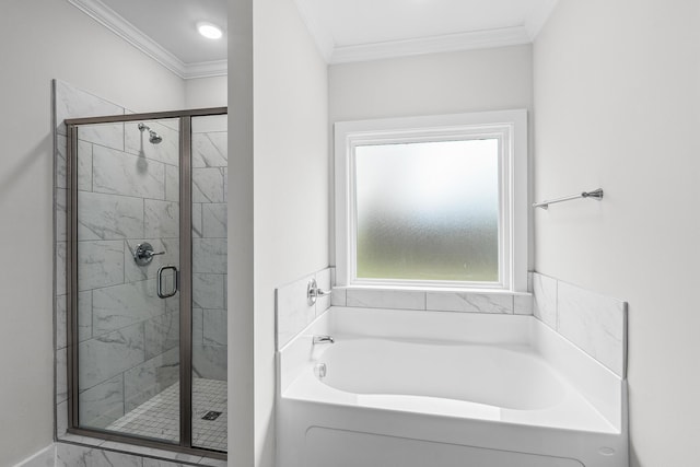 bathroom featuring ornamental molding, a shower stall, and a garden tub