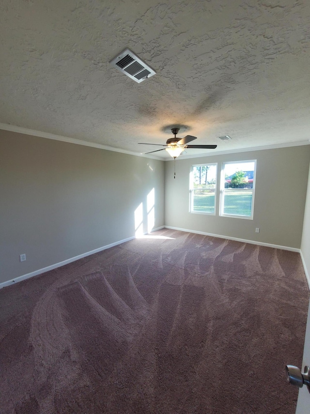 unfurnished room featuring carpet, a textured ceiling, and crown molding