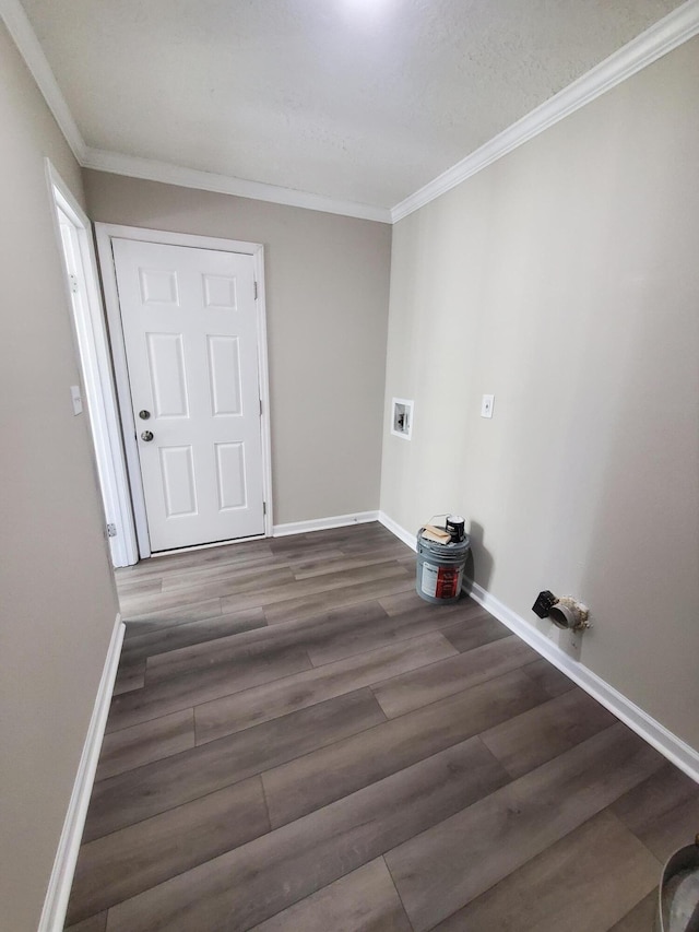 washroom with crown molding, hookup for a washing machine, and dark hardwood / wood-style floors