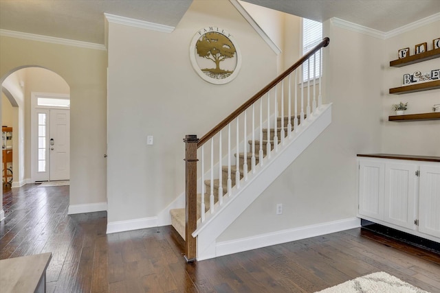 4074 Ellington Dr, Grovetown, GA 30813 - stairway featuring arched walkways, crown molding, hardwood / wood-style floors, and baseboards