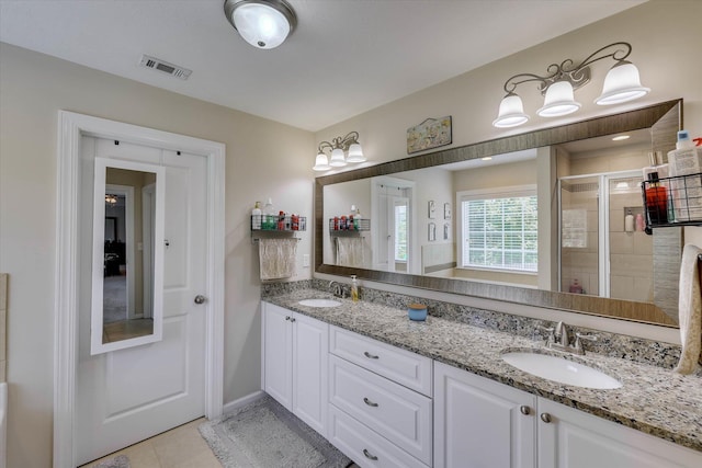 4074 Ellington Dr, Grovetown, GA 30813 - bathroom with a stall shower, double vanity, tile patterned floors, and baseboards