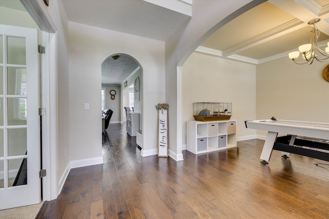 4074 Ellington Dr, Grovetown, GA 30813 - foyer entrance with arched walkways, wood-type flooring, a chandelier, baseboards, and crown molding