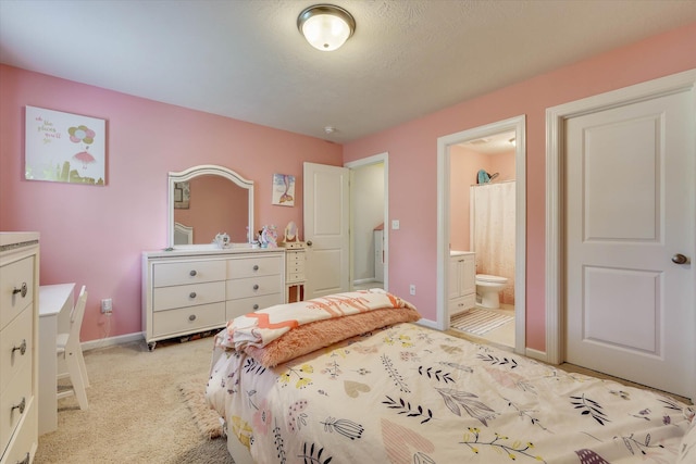 4074 Ellington Dr, Grovetown, GA 30813 - bedroom with light carpet, ensuite bathroom, and baseboards