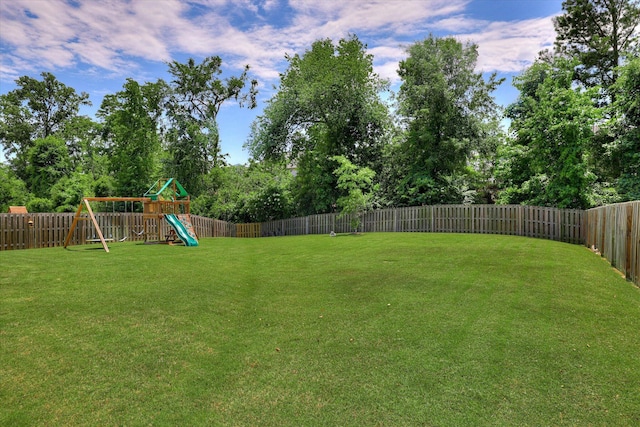 4074 Ellington Dr, Grovetown, GA 30813 - view of yard with a playground and view of wooded area