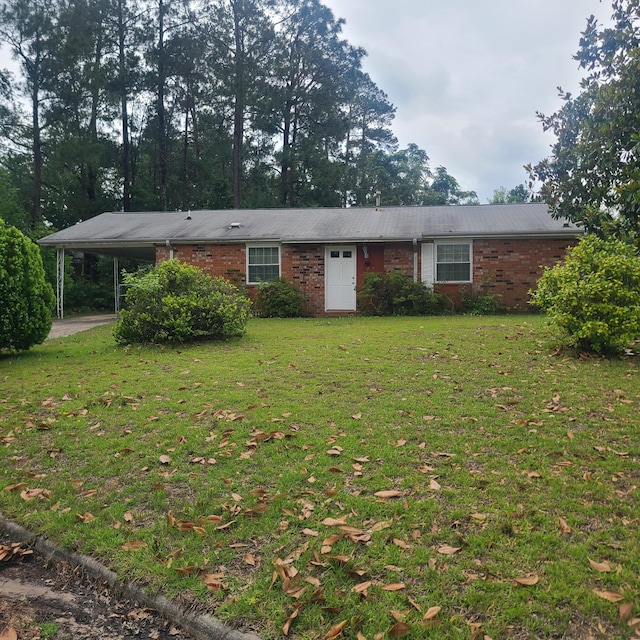 3648 N Madrid Dr, Augusta, GA 30906 - ranch-style home with brick siding, a front yard, and an attached carport