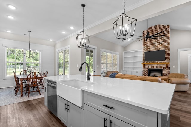 7181 Moontown Rd, Appling, GA 30802 - kitchen with a chandelier, stainless steel dishwasher, open floor plan, a fireplace, and recessed lighting
